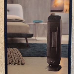 DeLonghi ceramic heater, new in original box unused.